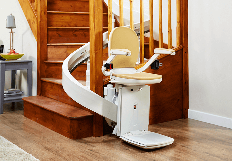 Curved stairlift at the bottom of staircase